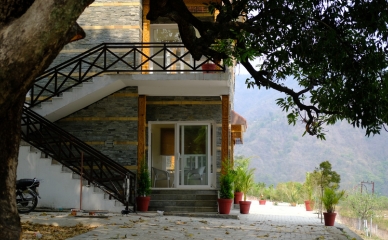 Guests relaxing in the lush green retreat garden