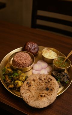 Traditional Pahadi Thali with millet roti, bhatt ki dal, and local Kumaoni dishes at Himalayan Rasoi